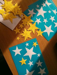 some paper stars are laying on a table