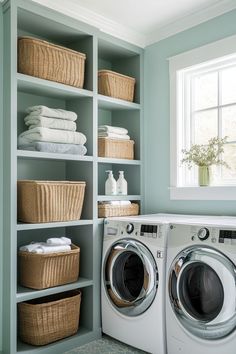 a washer and dryer in a laundry room with baskets on the shelves next to them