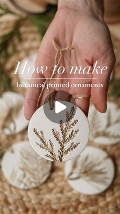 a person holding a white ornament with plants on it and the words how to make botanical printed ornaments