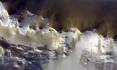 an aerial view of snow covered mountains in the wintertime, taken by nasa astronauts