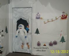 the door is decorated with christmas decorations and toys