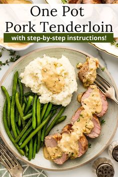 a plate with meat, mashed potatoes and green beans on it next to a fork