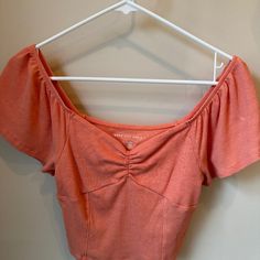 American Eagle Short Sleeve Top. Color Orange. Never Worn But No Tags. Size Xs Fitted Casual Crop Top For Spring, Fitted Casual Spring Crop Top, Fitted Summer Crop Top With Short Sleeves, Fitted Casual Crop Top For Day Out, Fitted Casual Blouse For Day Out, Fitted V-neck Summer Top, Casual Fitted Crop Top Blouse, Casual Short Sleeve Spring Crop Top, Cute Fitted Cropped Tops