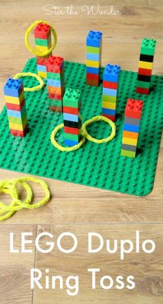 lego duplo ring toss game on the floor next to scissors and rubber bands