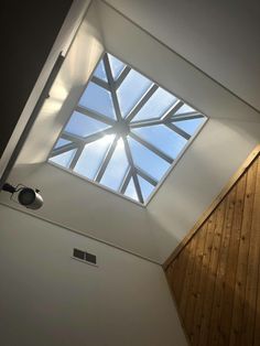 the skylight is shining brightly into the room