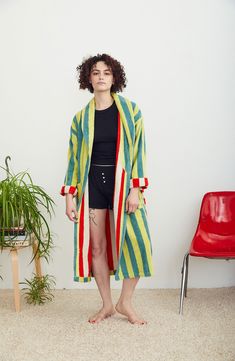 Designer Ellen Van Dusen doubles down on her love of stripes with this cotton-terry robe playfully patterned with a contrasting interior colorway and tie. 46" length (size Medium) Shawl collar Front patch pockets Removable tie belt 100% cotton Machine wash, tumble dry Made in Portugal Striped Long Sleeve Robe For Loungewear, Multicolor Cotton Outerwear For Loungewear, Multicolor Cotton Robe For Loungewear, Cotton Robe With Tie Waist, Multicolor Cotton Beach Outerwear, Long Sleeve Cotton Robe With Tie Waist, Multicolor Cotton Robe For Spring, Dusen Dusen, Terry Robe