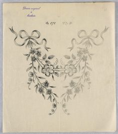 an old envelope with flowers and bows on the front, and in the back side