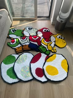 the rugs on the floor are all different shapes and sizes, but one has an image of mario