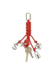 a key chain with several keys hanging from it's end and two hearts attached to it