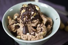 a bowl filled with chocolate ice cream and nuts