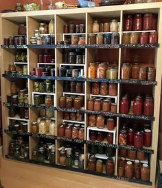 the shelves are filled with many different kinds of jars