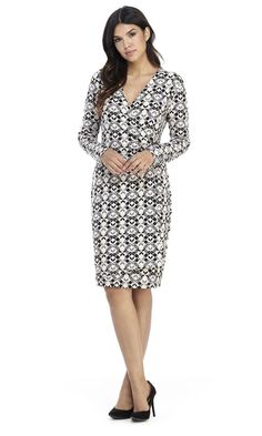 Make this London Times T4810M faux wrap dress a bold addition to your wardrobe. Stuns with geometric print, this jersey fabric dress showcases a pair of slender long sleeves and a surplice V-neckline bodice, with gathered side and a silver metal accent. The wrap skirt columns down in sheath silhouette and finishes at above the knee length. Look sophisticated and mature in this chic London Times creation. Style: imap_T4810M Details: Jersey, Long Sleeve, Surplice bodice, Enclosed back, Hidden back Fitted Knee-length Wrap Dress For Fall, Elegant Long Sleeve Dress With Surplice Neckline, Fitted V-neck Long Sleeve Dress, Fitted Long Sleeve V-neck Dress, Fitted Midi Dress With Surplice Neckline For Fall, Elegant Fitted Mid-length V-neck Dress, Chic Fitted Dress With Surplice Neckline, Fitted Fall Dress With Surplice Neckline, Fitted White Wrap Dress For Work