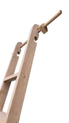 a wooden easel with an unfinished handle on the top and bottom part of it