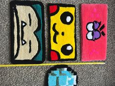 three rugs with cartoon characters on them laying on the floor next to each other