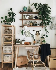 a desk with plants and baskets on it