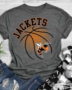 Looking for a unique way to show off your love for the BASKETBALL? Look no further than our BASKETBALL DTF Transfer! This transfer is perfect for adding a touch of personality to your t-shirts, bags or anything else that needs a bit of customization. Our transfer is made with high-quality direct to film technology, making it durable and long-lasting. Whether you're looking to show off your love for your favorite team or add a little flair to your clothing, our BASKETBALL DTF Transfer is the perfect choice. Our transfer is easy to apply, making it a great choice for anyone looking to create custom t-shirts or other items. Simply use a heat press to apply the transfer to your chosen fabric. At Rustic Grace, we're committed to providing high-quality, affordable heat transfer designs and heat Basketball Shirts Designs, Spartan Images, Basketball Shirts For Players, Basketball Shirt Ideas, Basketball Team Shirts, Boys Activities, Basketball Fan Shirts, Basketball Shirt Designs, Basketball Tshirt Designs