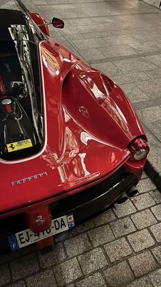 the rear end of a red sports car