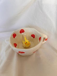 a bowl with a rubber ducky in it