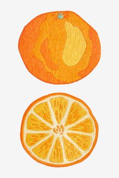 two oranges cut in half on a white background