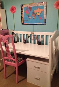 a white desk with drawers and a pink chair in front of it on the floor