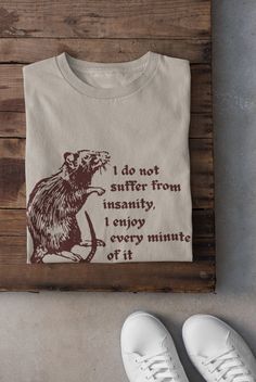 Rat T Shirt Printed on a super soft, cotton tee Dispatched in 5 working days or sooner Unisex Free UK delivery Material: 100% ringspun cotton. Chest (to fit): S  34/36   M  38   L  40/42   XL  44/46   XXL  48/50 ECO-FRIENDLY Each garment is made to order, reducing extra material and energy that would be otherwise wasted We use DTG printing process which is easier on the environment than screen-printing Our ink is bright and also eco-friendly. Do not tumble dry. Wash at 30 degrees c, inside out. Quirky Graphic Tees, Alt Shirts, Funny Quote Shirts, Rat Shirt, Clothing Grunge, Quote Shirts, Emo Clothing, Alt Clothing