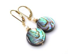 Natural flat round abalone earrings comes in your choice of boho sterling silver or elegant gold filled earrings closures and findings. Accented with a small white freshwater pearl. Sublime and beachy jewelry is perfect for women who love the ocean and summer fun in the sun!Earring Details:- Earring are 1.25 inches long (3.17 cm) with the earring closures shown- Abalone shells are 14 mm in diameter (.5 inches)- Choose sterling silver or 14k gold filled leverback earring closures via the drop dow Nickel-free Round Mother Of Pearl Jewelry, Pierced Round Mother Of Pearl Jewelry, Anniversary Mother Of Pearl Round Earrings, Elegant Abalone Shell Jewelry Gift, Elegant Abalone Shell Jewelry For Gifts, Adjustable Round Mother Of Pearl Earrings, Elegant Nickel Free Round Disc Earrings, Abalone Shell Jewelry For Pierced Ears As Gift, Nickel-free Abalone Shell Drop Earrings