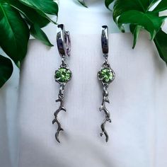 peridot fairy earrings, kawaii earrings , olive earrings, earrings dangle flower , peridot aesthetic earrings This earrings is made of molten sterling silver with high quality natural green peridot , made as a shape of olive leaf , perfect as a gift for a loved one or friend, for a statement piece, as an anniversary gift or for your mom Each earrings is handmade and therefore completely unique. it takes 5 to 16 working days to create and ship. Materials: -925 sterling silver -Natural stone of yo Green Sterling Silver Dangle Flower Earrings, Dainty Green Flower Earrings, Green Sterling Silver Flower Drop Earrings, Whimsical Green Dangle Earrings, Whimsical Green Hypoallergenic Earrings, Green Peridot Dangle Earrings, Nature-inspired Green Dangle Flower Earrings, Green Drop Earrings With Dangling Charms, Dainty Green Dangle Flower Earrings