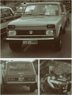 an old car parked next to other cars on the side of the road in black and white