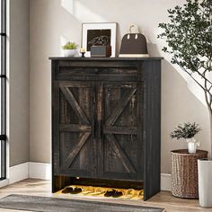 a wooden cabinet sitting in the corner of a room next to a potted plant