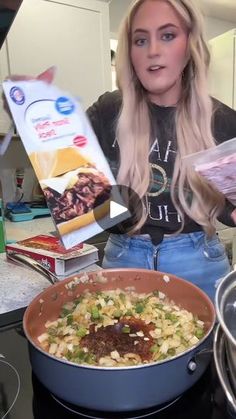 a woman is holding up some food in front of her