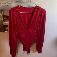 Long Sleeve Red Bodysuit - Size Small -Never Worn Red Party Jumpsuits And Rompers, Fitted Red V-neck Bodysuit, Red Fitted V-neck Bodysuit, V-neck Solid Color Bodysuit For Party, Red V-neck Bodysuit For Spring, Spring Red V-neck Bodysuit, Red Solid Color Jumpsuits And Rompers For Night Out, Red Solid Color Jumpsuit For Night Out, Elegant Red Long Sleeve Bodysuit