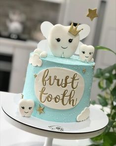 a blue and white cake with an elephant on top that says frosted footh