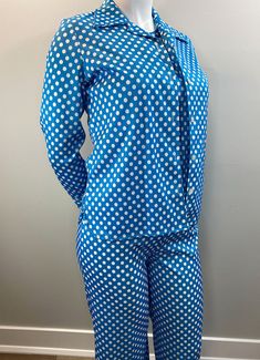 "Love this 3 piece set of pants, shell (tank) and blouse/jacket. The fabric is a clear blue and crisp white polka dot throughout all 3 pieces. The pants have an elastic waist and a flare to the leg. The shell (tank) is simple and easy with a crew neck. The blouse is kind of a shirt/jacket. Long sleeves with a great wide collar and white plastic buttons. The hem is curved to the side seams for a lovely feminine detail. Unlined. Slight stretch. Just fantastic! Great vintage size. Label: 100% Polye Fitted Vintage Blue Set, Blue Fitted Vintage Set, Retro Fitted Blue Sets, Retro Blue Fitted Sets, Fitted Polka Dot Sets For Spring, Vintage Blue Long Sleeve Sets, Millinery Supplies, Sleeveless Shirt Dress, Leisure Suit