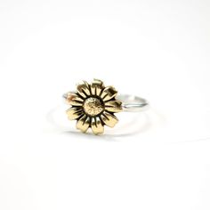 Mammoth Sunflower Ring, Flower Ring, Stack Ring, Silver Stack Ring, Sunflower Stack Ring, Boho Ring, Sterling Silver, Antiqued, Stack Ring This adorable brass and sterling silver sunflower stack ring is one to love! Perfect to wear everyday and if added to other stack rings you can come up with your own unique style too! This is a CUSTOM ORDER There is a processing time for this order. For updates on production times for custom orders please see my shop announcement. Production times vary depend Adjustable Nickel-free Flower Ring For Promise, Adjustable Nickel-free Flower Promise Ring, Adjustable Flower Ring With Birth Flower Detail, Nickel Free Adjustable Round Flower Ring, Bohemian Flower Ring For Promise, Adjustable Nickel-free Flower-shaped Rings, Nickel-free Adjustable Round Flower Ring, Adjustable Rings With Flower Charm For Gifts, Adjustable Metal Flower Ring With Open Design