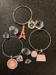 Paris Me Please Charm Bracelets shown here are made with different shades of pink Nickel-free Pink Bracelets For Friendship, Trendy Pink Charm Bracelet For Friendship, Trendy Pink Friendship Charm Bracelet, Pink Nickel-free Charm Bracelet, Pink Metal Beaded Bracelets With Charms, Pink Adjustable Charm Bracelet For Friendship, Pink Metal Beaded Bracelet With Charms, Trendy Pink Jewelry With Charms, Pink Metal Charm Bracelet For Gift