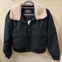 Nwt Hollister Navy Bomber Jacket. Black Fur Lining Inside Cold Weather Utility Outerwear With Padded Collar, Casual Winter Utility Jacket With Padded Collar, Winter Utility Outerwear With Zipper Closure, Utility Outerwear With Zipper For Winter, Army Jacket Women, Hollister Jacket, Varsity Jacket Women, Suede Biker Jacket, Womens Faux Fur Coat