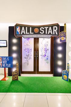 an all star basketball themed party with neon lights and decorations on the front door, along with signs that say it's time to play