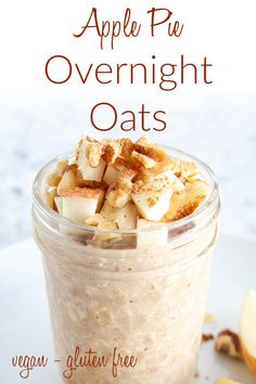 an apple pie overnight oats in a jar with apples and cinnamon on the side