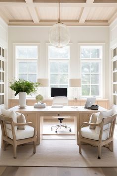 a home office with two chairs and a desk