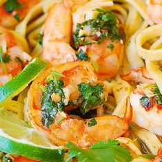 pasta with shrimp and spinach in a bowl