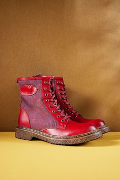 Created to make a splash, Soffia's Hot Stepper Leather Combat Boots will be sure to raise a few eyebrows - perfect for showing your flair for the daring and unique. These fiery red boots feature supple leather uppers with all the classic combat boot details. Take the streets in style! 1'' heel 9.2 shaft 11.5 circumference Zip / lace-up closure Genuine leather upper Leather / Textile lining Leather footbed Leather midsole Leather insole Rubber sole Bold Leather Boots With Round Toe, Trendy Leather Boots With Red Sole, Bold Red Leather Boots, Red Boots With Rubber Sole And Flat Heel, Bold Leather Boots With Red Sole, Leather Combat Boots, Reindeer Headband, Red Boots, Combat Boot