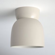 a white light fixture hanging from the ceiling