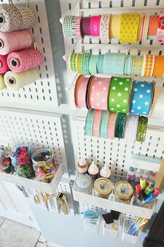 there are many different ribbons on the shelves