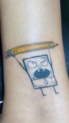 a cartoon character with a pencil in his mouth on the side of a woman's leg