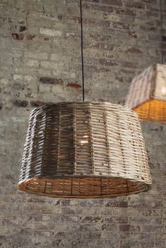 two woven lamps hanging from the ceiling