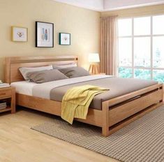 a bed room with a neatly made bed and two nightstands next to a window