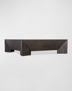 a wooden shelf sitting on top of a white wall