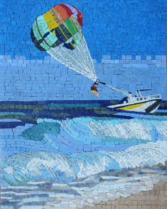 a painting of a hot air balloon being pulled by a boat in the ocean on a mosaic tile wall