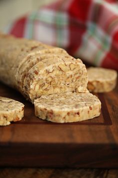 some kind of cracker sitting on top of a wooden cutting board