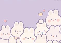 a group of cute little bunnies standing next to each other in front of a purple background